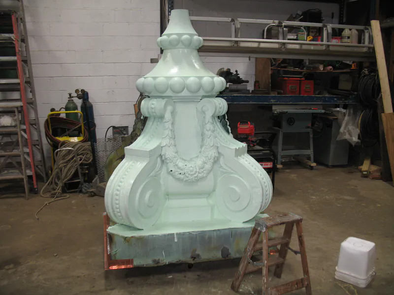 Restored copper ornament primed and ready to return to the building
